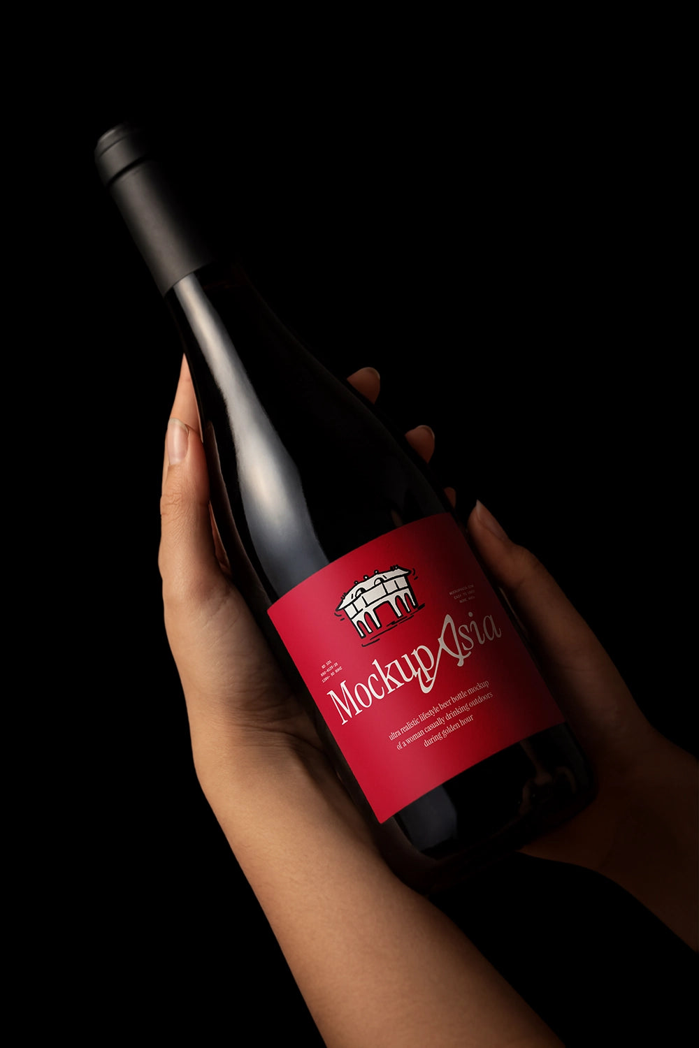 Luxury packaging mockup featuring hand-held bottle and customizable label