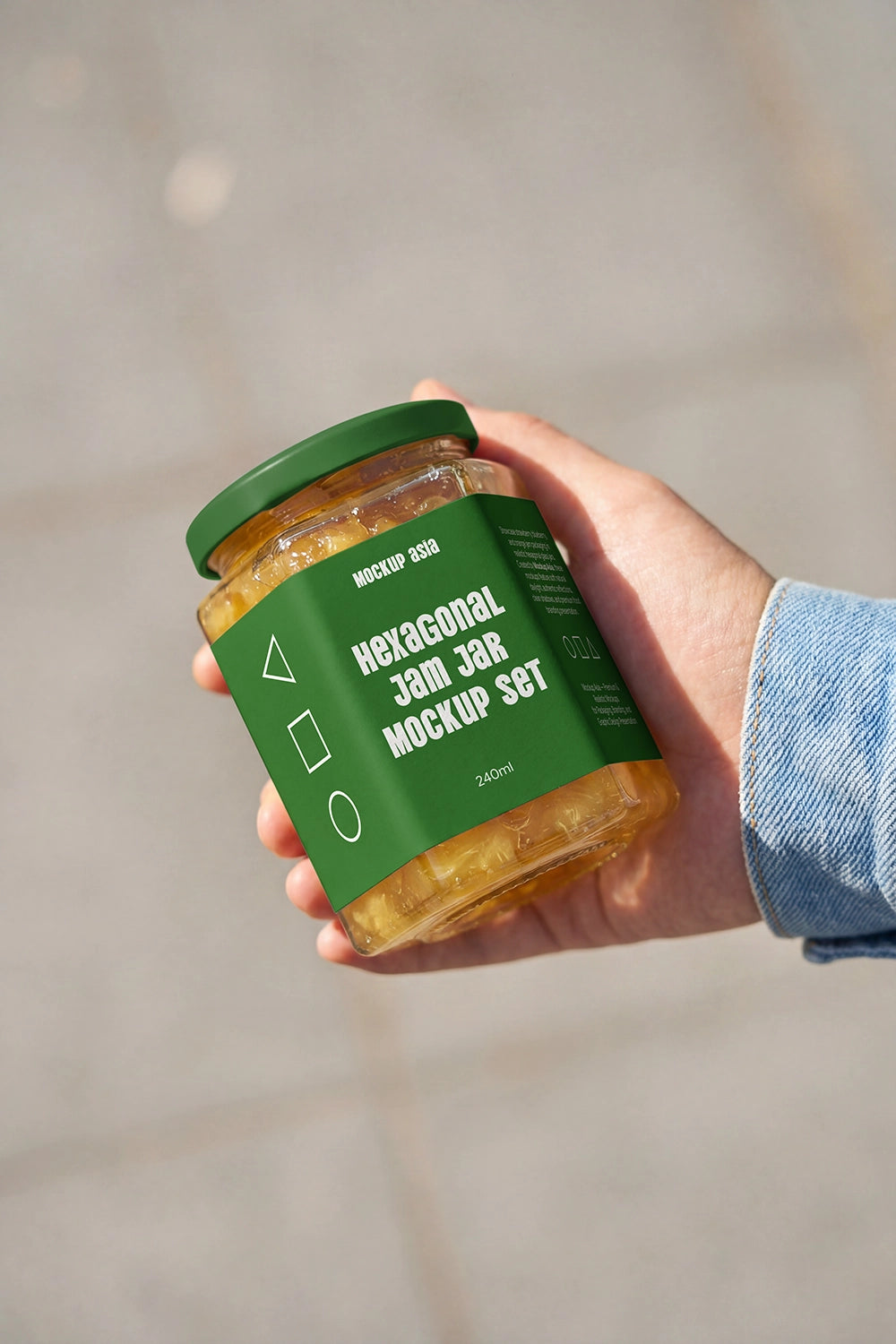 Hand holding hexagonal food jar mockup with natural lighting