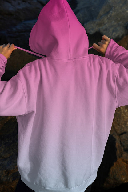 realistic hoodie mockup worn by person from behind with rocky background and soft lighting