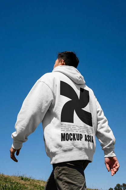 hoodie mockup back view on model walking outdoor with blue sky and natural sunlight