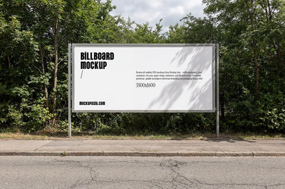 wide roadside billboard mockup with forest background and natural sunlight shadows