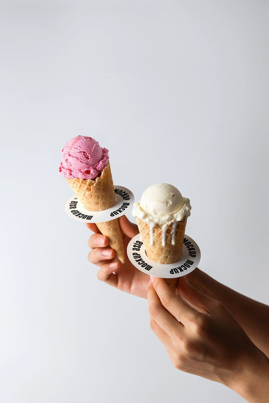 Ice cream cone mockup with two cones held in hands featuring strawberry and vanilla scoops