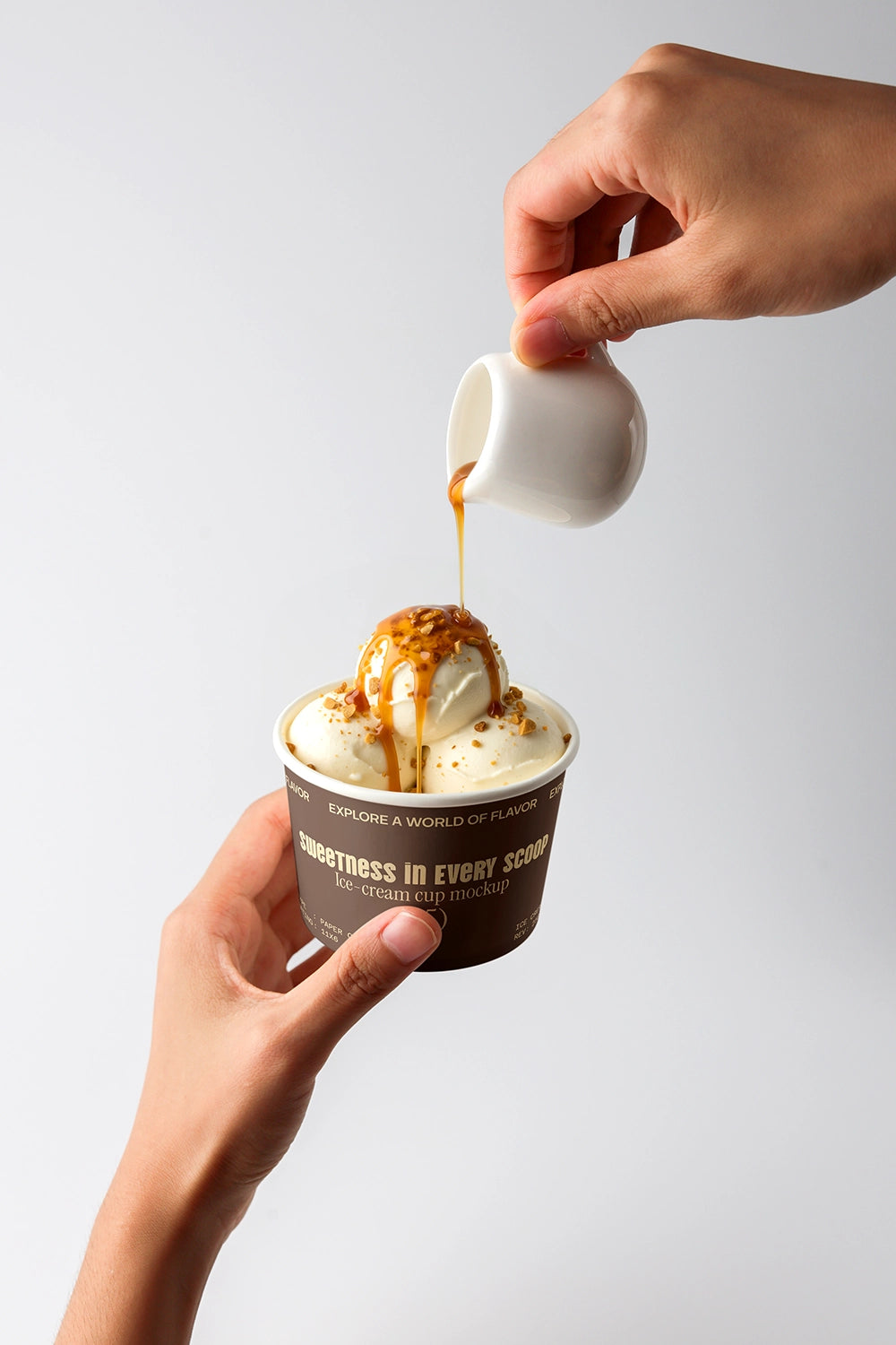 Dessert mockup with ice cream cup and caramel topping action shot minimal background