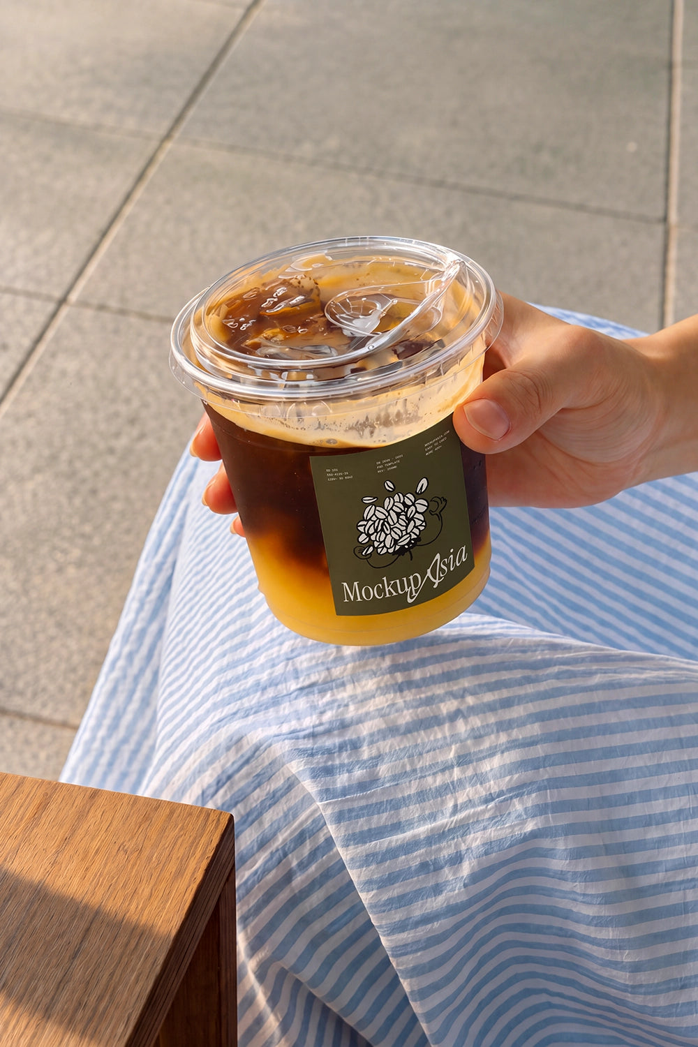 Takeaway clear cup sticker mockup with layered espresso and orange juice