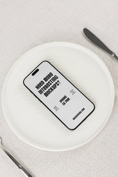 mobile device mockup placed on plate with minimal aesthetic and soft lighting