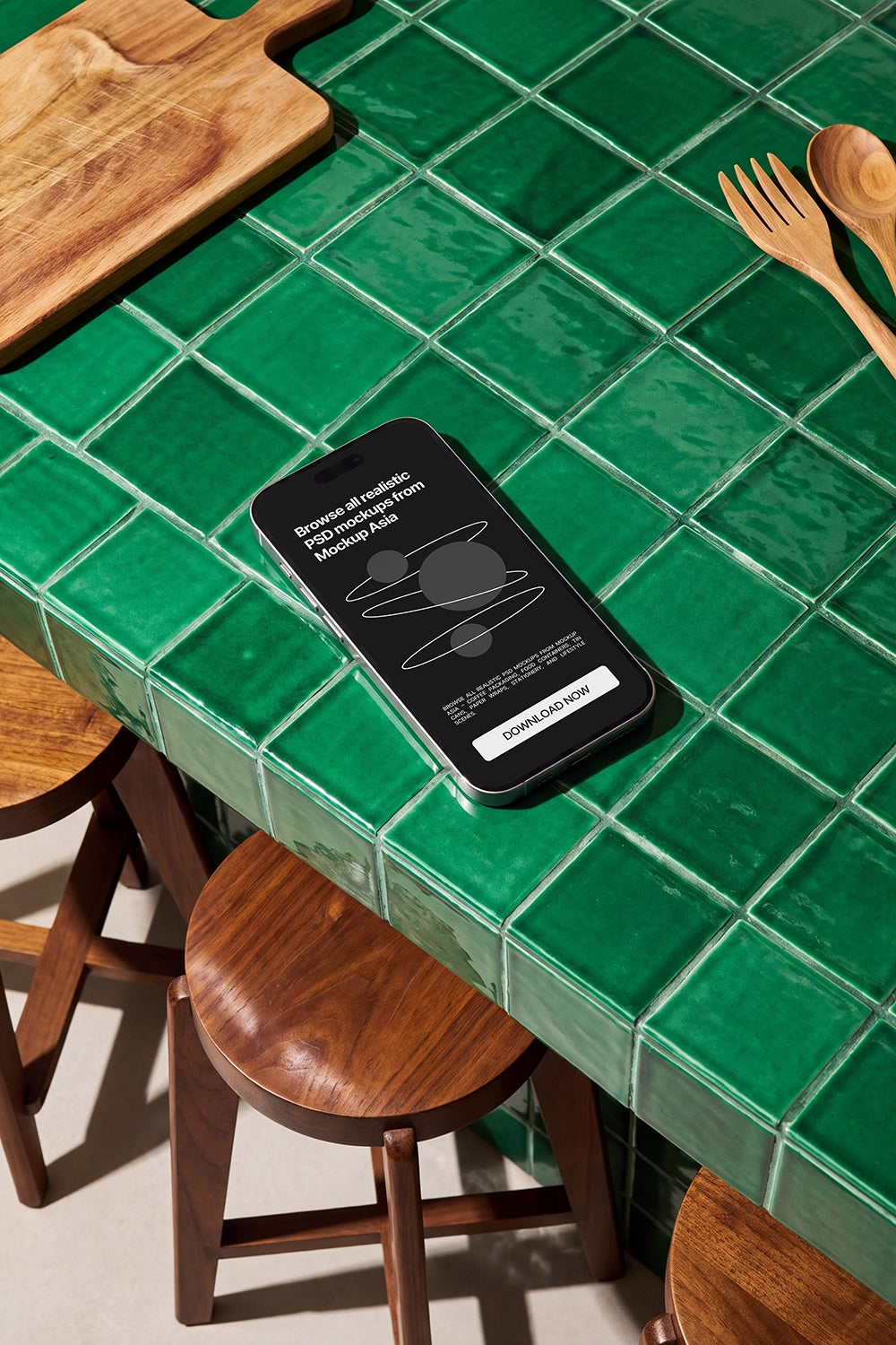 Smartphone PSD mockup surrounded by wooden chairs and kitchen accessories