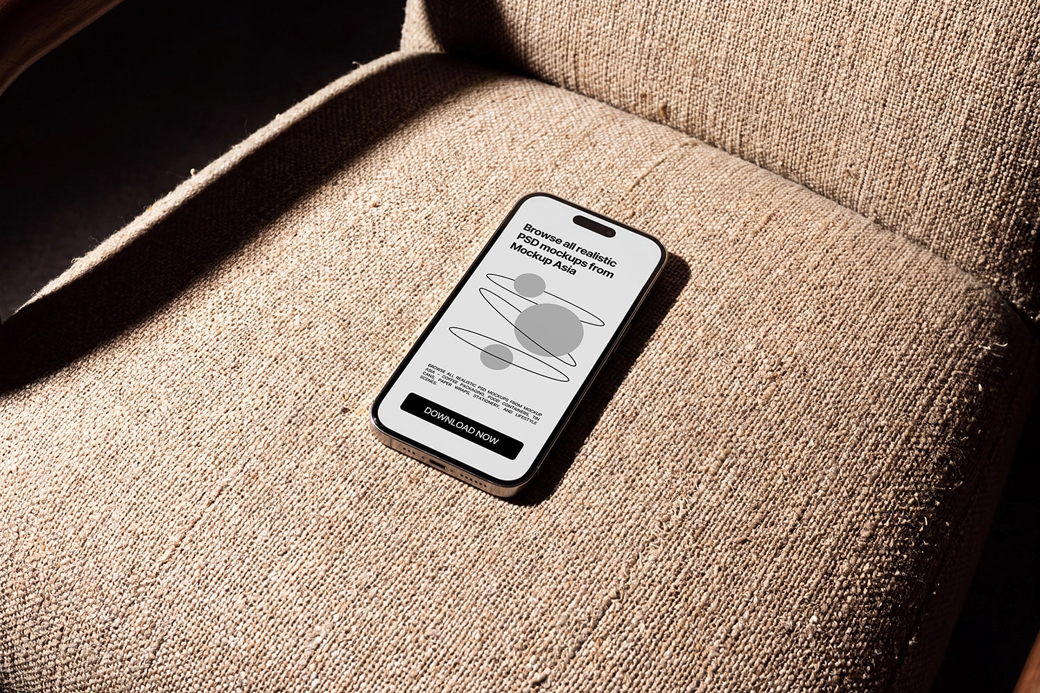 Realistic iPhone mockup on textured fabric under natural sunlight