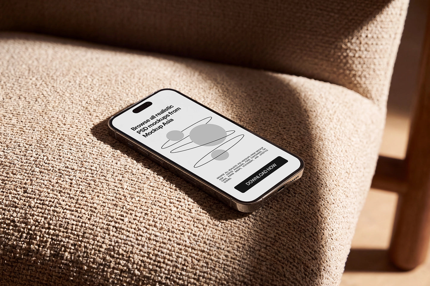 Realistic iPhone mockup resting on a textured sofa in sunlight