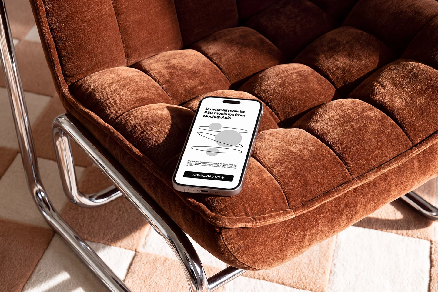 Realistic iPhone mockup placed on a brown lounge chair in warm sunlight