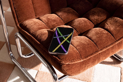 Smartphone screen mockup on textured fabric chair with realistic shadows