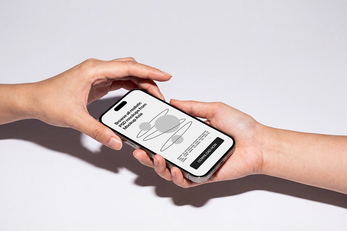 Two hands holding a smartphone against a clean white background. The phone screen displays a minimalist app interface with a gray ring graphic and text, and the phone itself has a black front and silver edges.