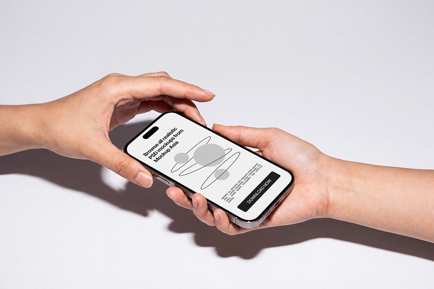 Two hands holding a smartphone against a clean white background. The phone screen displays a minimalist app interface with a gray ring graphic and text, and the phone itself has a black front and silver edges.