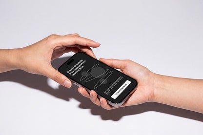 Hand holding iPhone PSD mockup with editable screen design