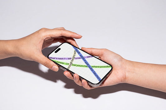 Realistic iPhone mockup held naturally between two hands