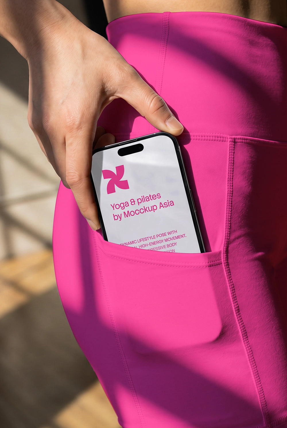 Fitness mobile UI mockup with iPhone placed naturally in athletic wear pocket