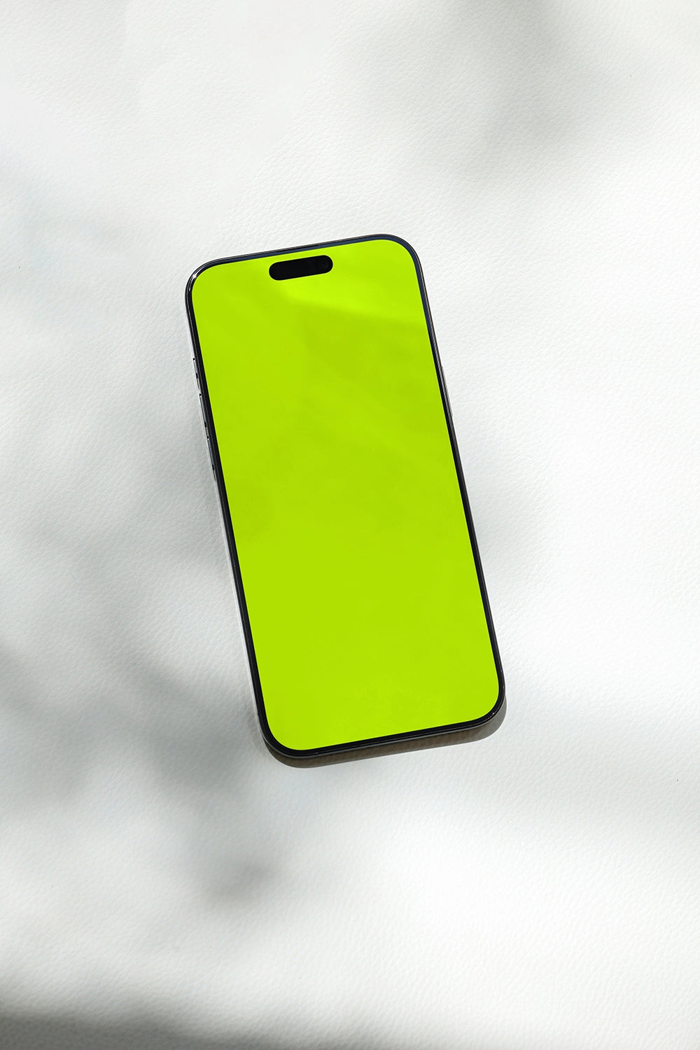 iphone screen mockup on fabric background with subtle shadow, modern product presentation