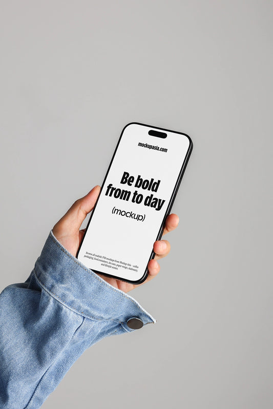 iphone mockup held in hand with denim sleeve, minimal app presentation scene
