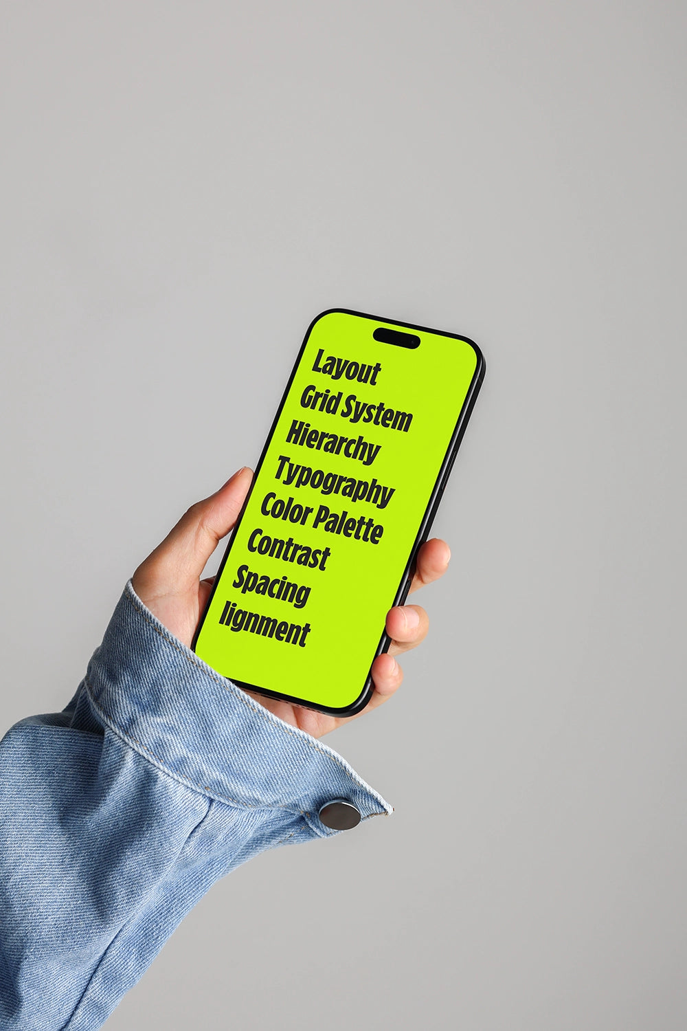 smartphone mockup in hand with denim outfit and clean background, modern UI display