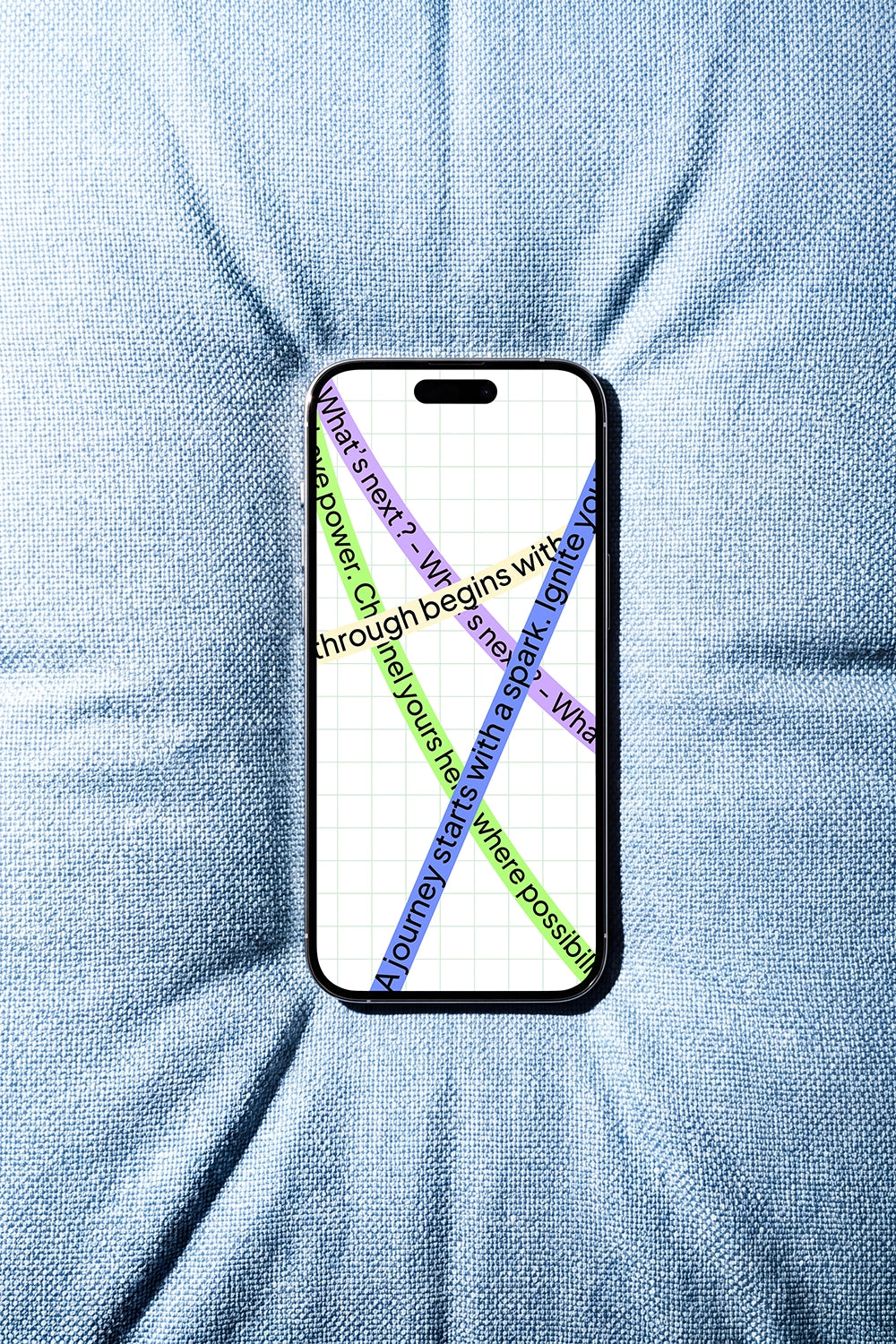 Top view iPhone mockup on textured blue fabric