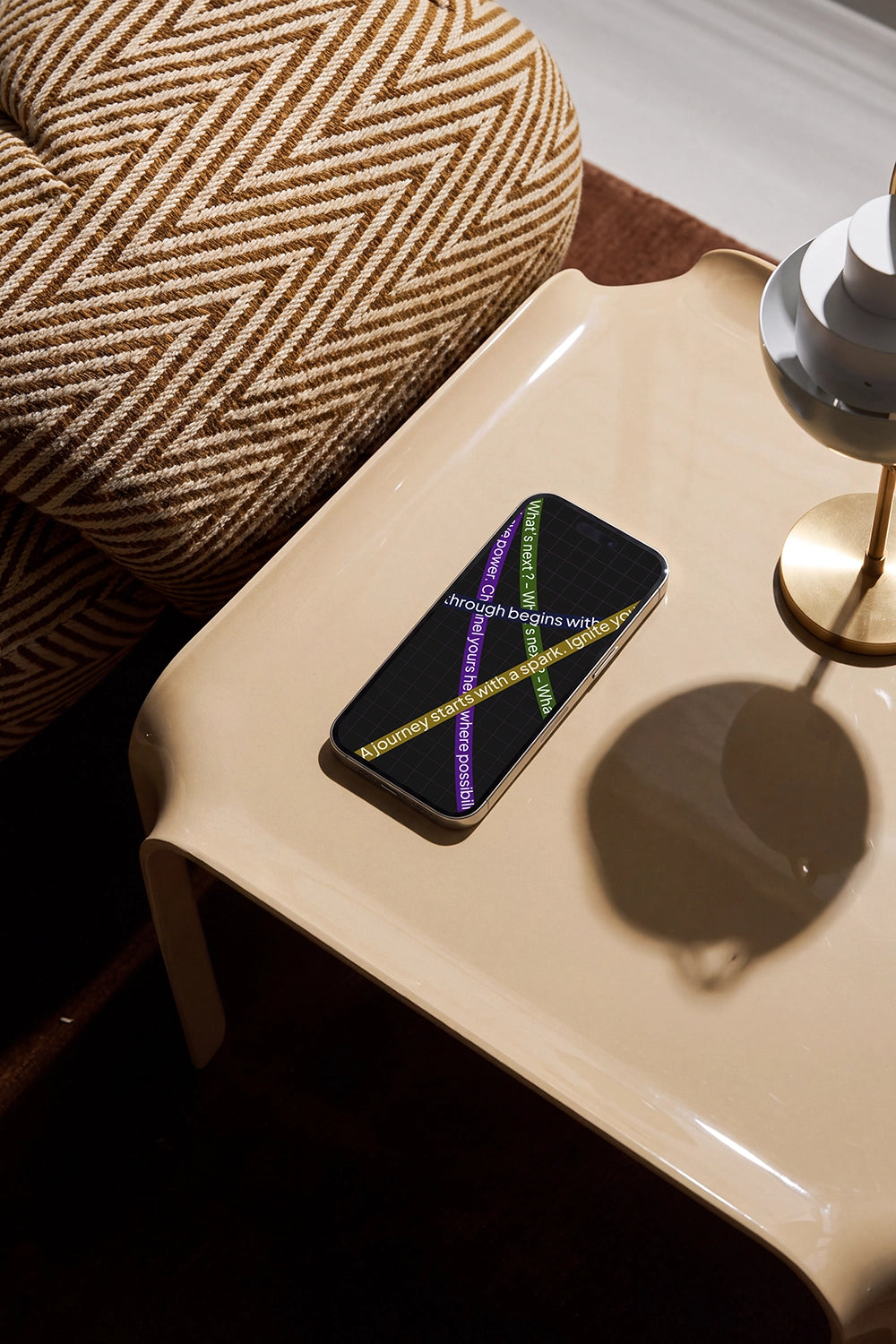 iPhone screen mockup in a warm modern interior with deep shadows