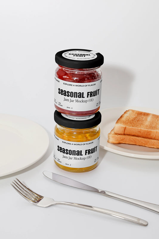 Stacked jam jar mockup with seasonal fruit labels next to toast and breakfast table setup