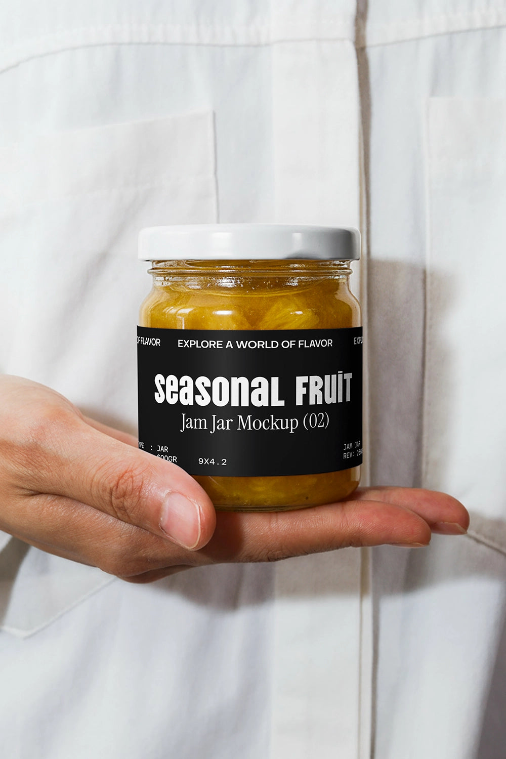Jam jar packaging mockup in hand with clean label design and minimal background