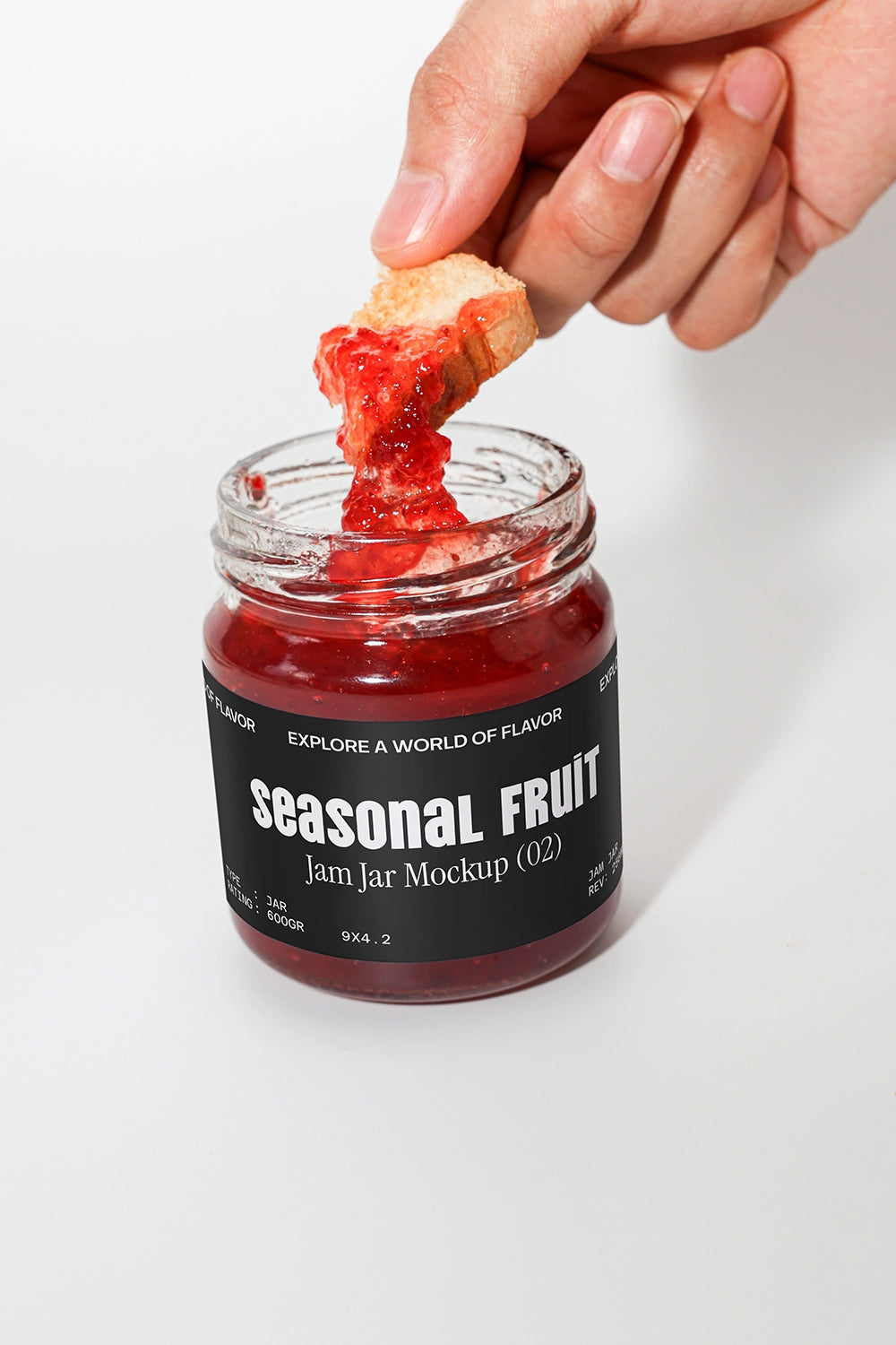 Seasonal fruit jam jar mockup with hand dipping bread and realistic texture detail