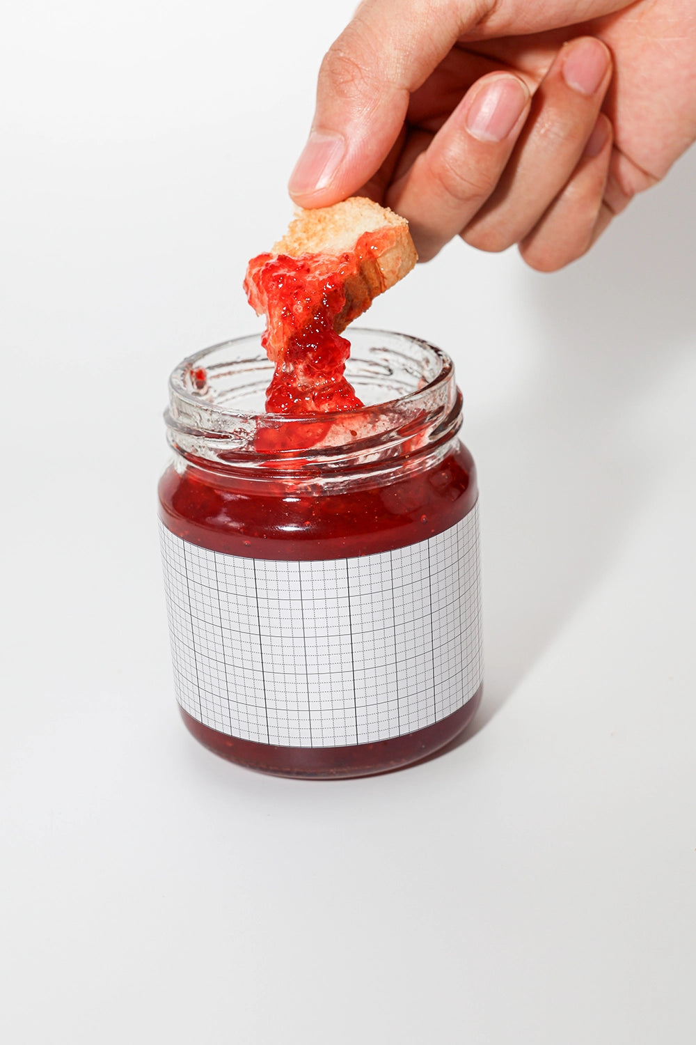 Food packaging mockup with open jam jar and dripping strawberry jam on bread