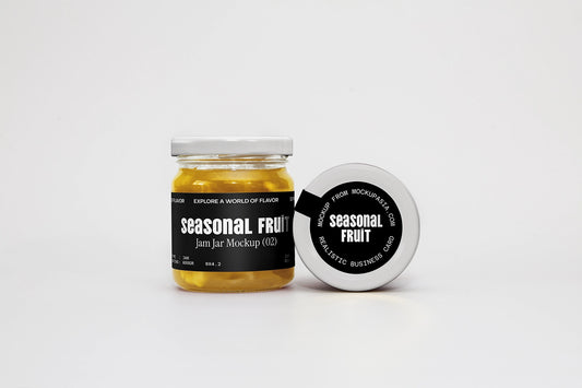 Jam jar mockup with black label and white lid featuring seasonal fruit branding design