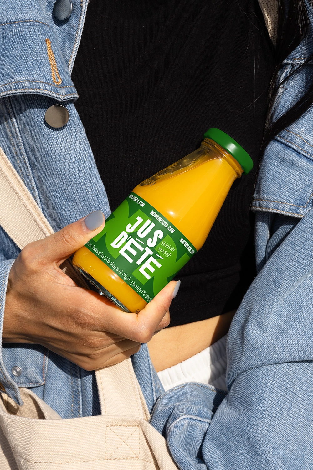 Orange juice bottle mockup handheld natural light branding presentation template casual outfit