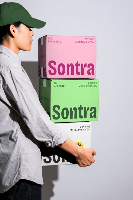 Stacked packaging box mockup with colorful cardboard boxes carried by person side view