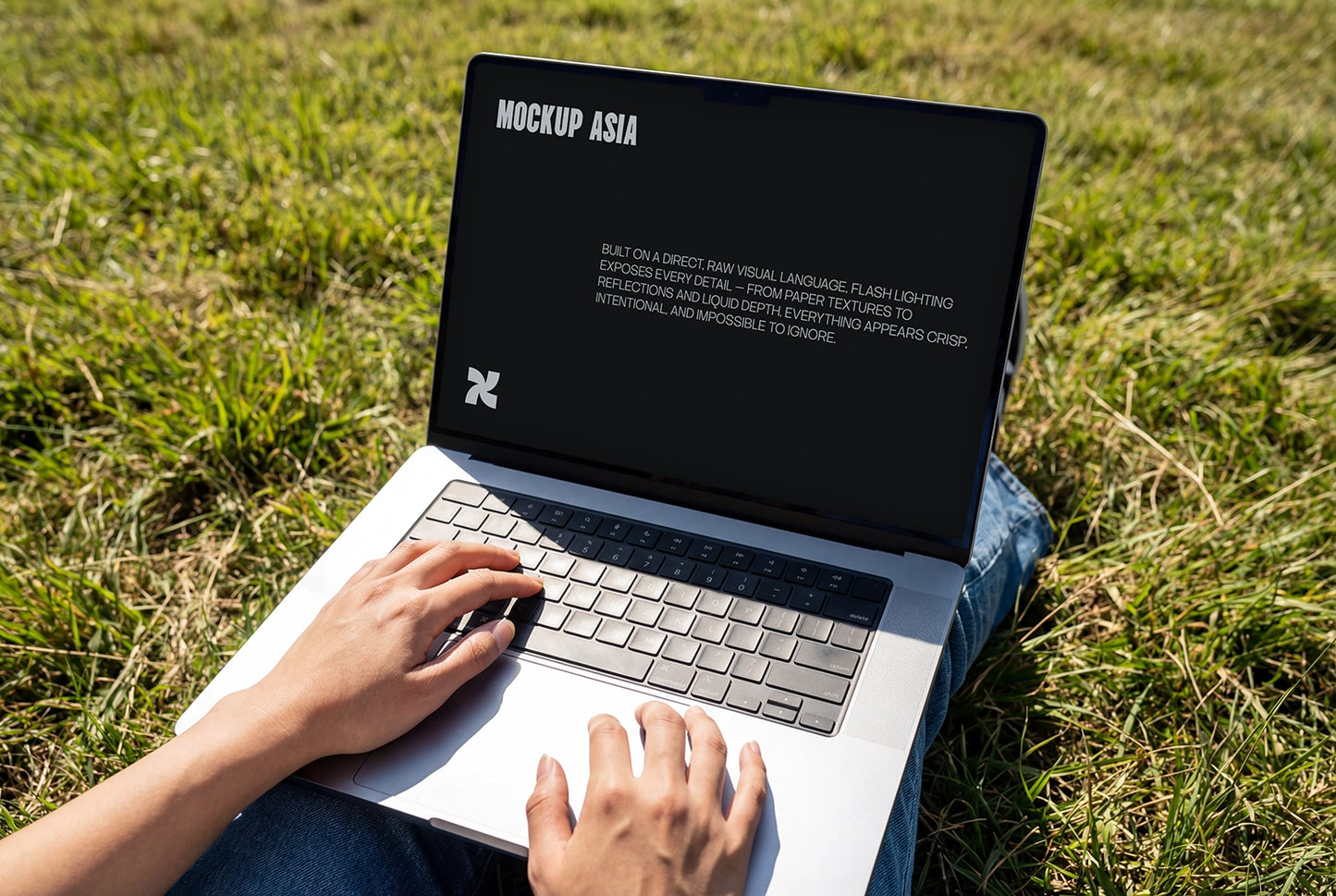 realistic laptop mockup used outdoors on grass with clean screen branding display