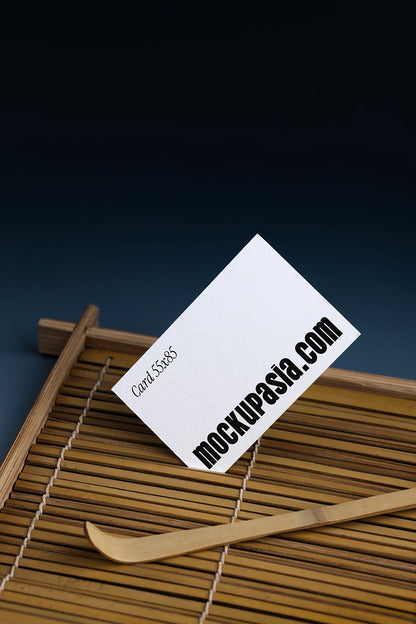 business card mockup on bamboo mat with tea spoon, minimal branding presentation