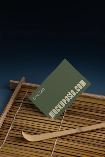 card mockup with textured paper on bamboo surface, clean and natural branding scene
