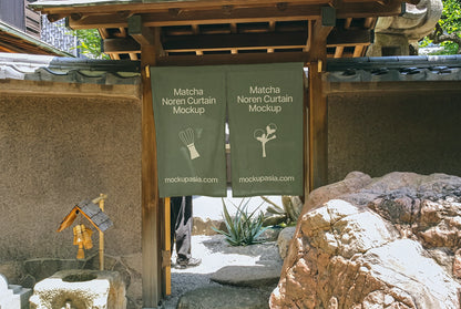 Noren fabric curtain mockup with stone wall and garden, matcha brand identity