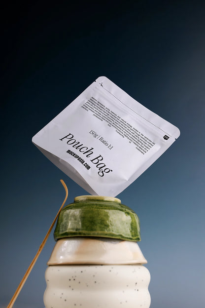 White matcha pouch packaging mockup with realistic folds and texture