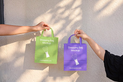 Two paper bag mockups green and purple color variation branding