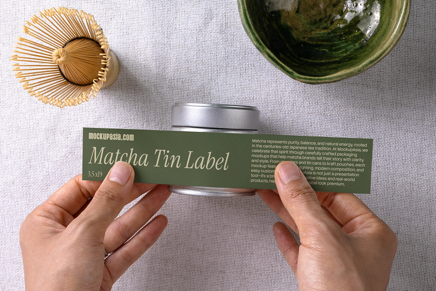 label mockup for matcha tin packaging with hands applying label, realistic branding scene