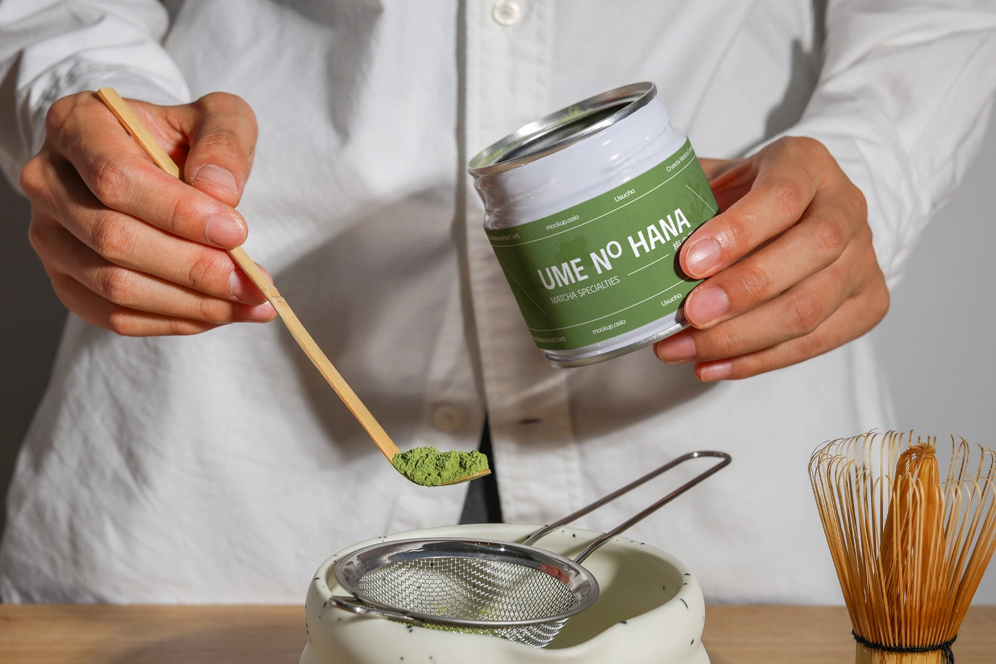 matcha packaging mockup with jar and bamboo spoon, lifestyle product preparation close-up
