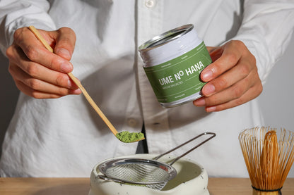 matcha packaging mockup with jar and bamboo spoon, lifestyle product preparation close-up
