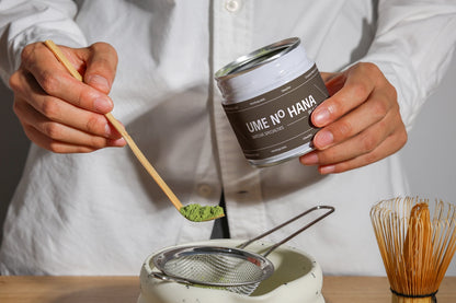 green tea matcha jar mockup with powder scoop and sifter, modern branding presentation