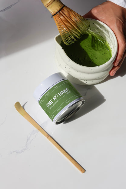 matcha tea mixing mockup with whisk and ceramic bowl, realistic product branding setup