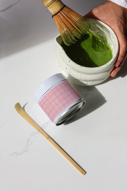 matcha drink preparation mockup with whisk and jar on marble surface, modern branding presentation