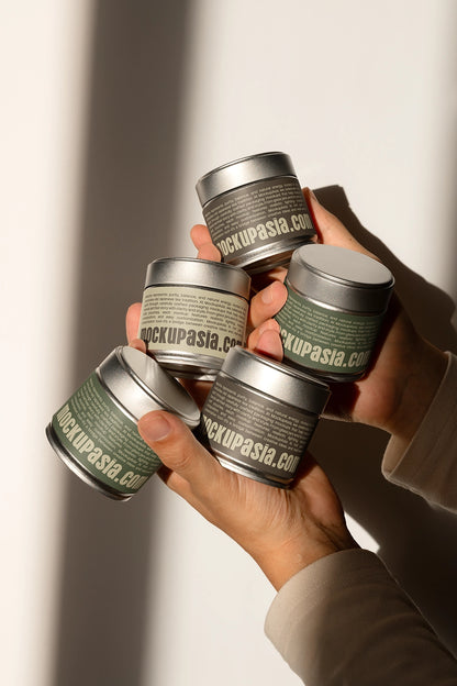 matcha packaging tin mockup collection in hands, realistic product interaction and branding scene