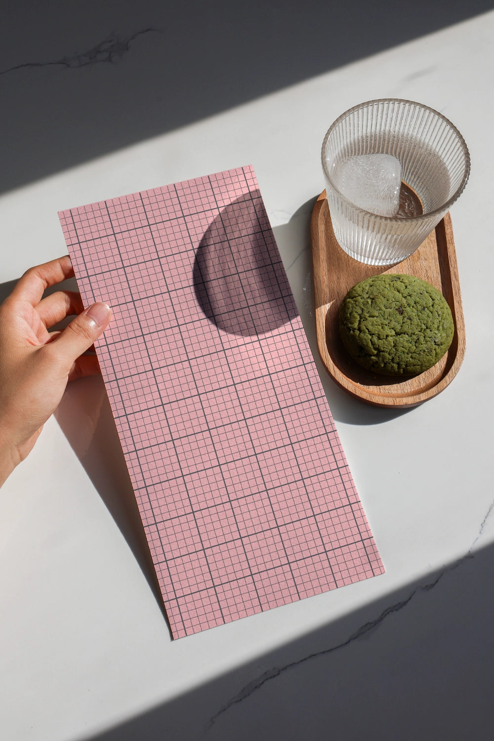food menu mockup with branding design held by hand, minimal lifestyle cafe scene
