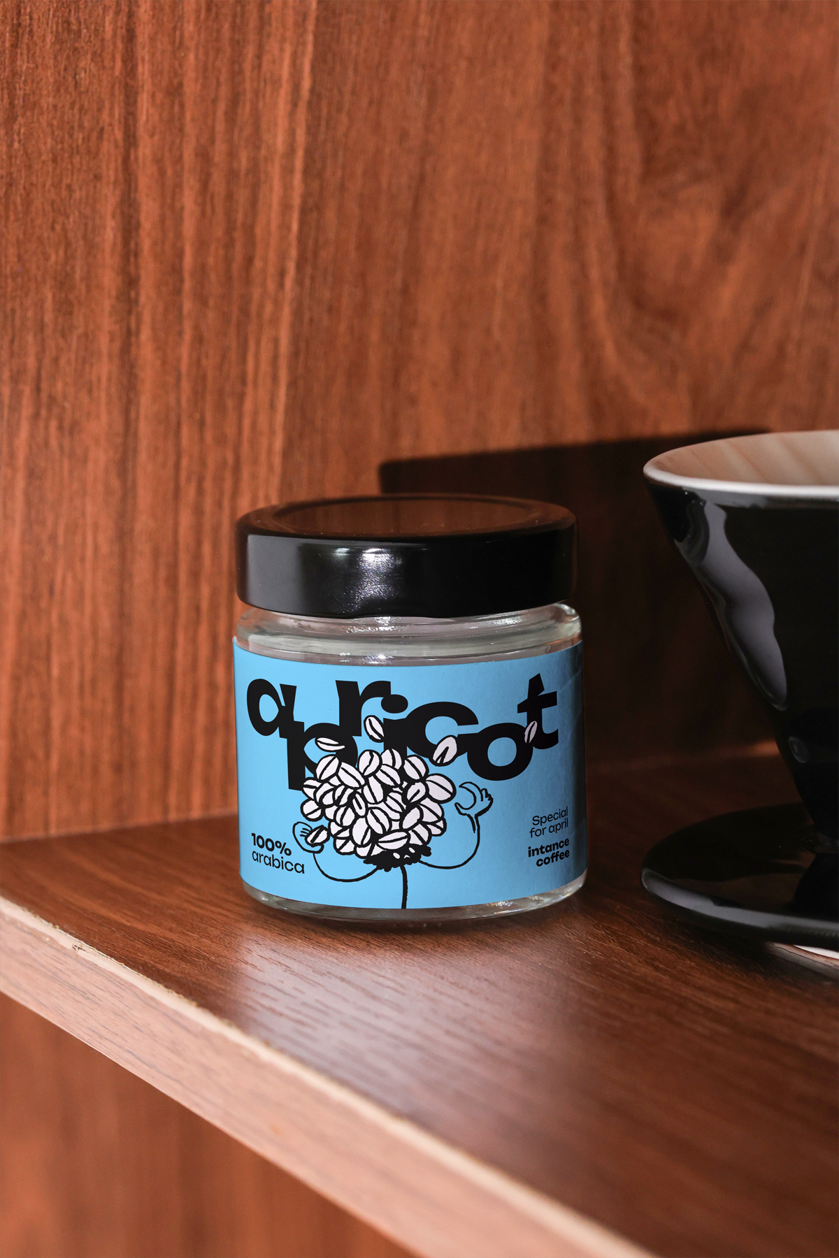 Apricots Coffee Collection bundle featuring a jar with a label showing fresh apricots and coffee beans, displayed on a wooden surface.