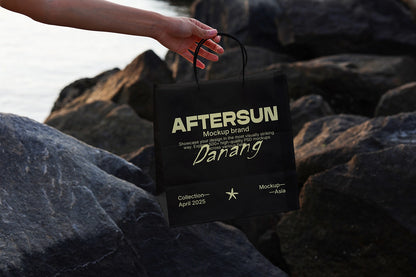 minimal paper bag mockup with rocky surface and natural light packaging presentation