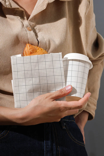 cafe branding mockup with takeaway cup and paper bag, lifestyle food and beverage setup