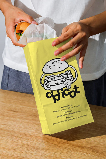 burger takeaway packaging mockup with paper bag and hands, minimal food branding setup