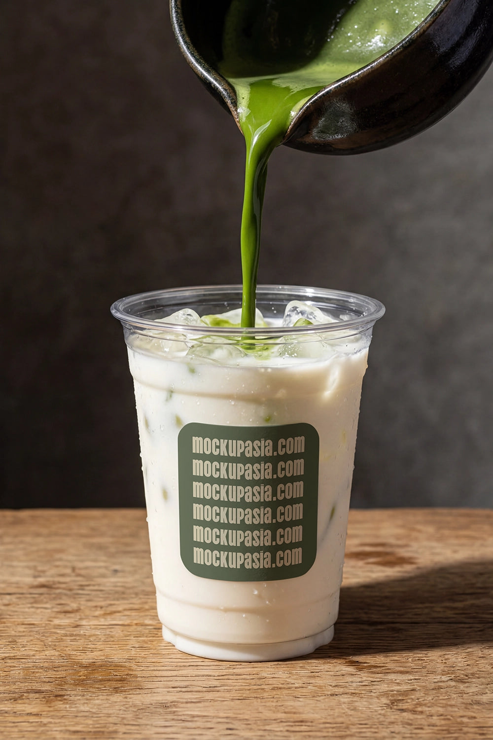 matcha latte mockup with pouring green tea over iced milk, dynamic drink presentation